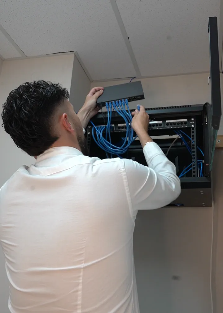 Flash engineer installing a network rack for a South West Sydney business